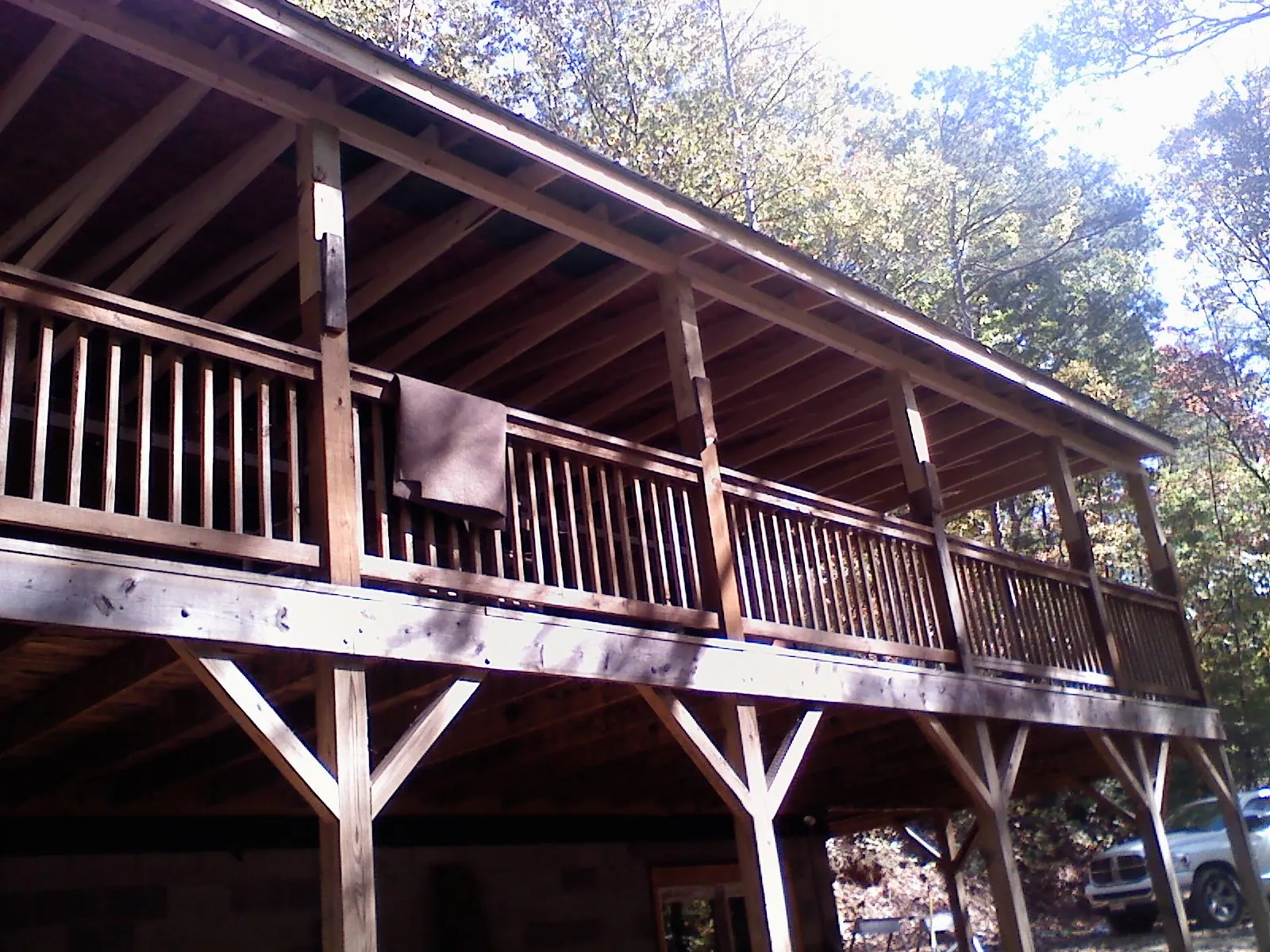 Timber framing under a new elevated porch and deck — Roof Leak Repair in Alex by Roofing Brothers
